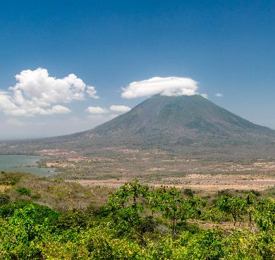 Nicaragua  outdoor sky grass mountain cloud nature landscape field hill background stratovolcano shield volcano grassy overlooking extinct volcano volcano hillside highland lush clouds distance land tree plant