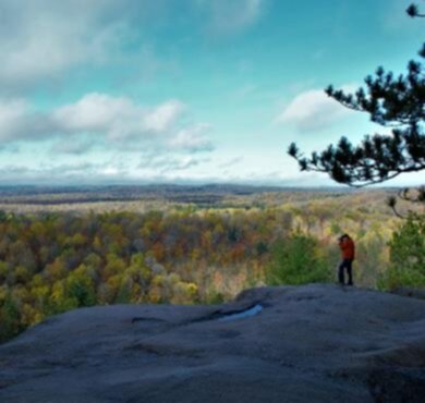 Algonquin Provincial Park trail - hiking in Algonquin Park, Almaguin Highlands, Muskoka and Parry Sound  tree outdoor sky autumn mountain fall landscape cloud nature plant hillside lush person