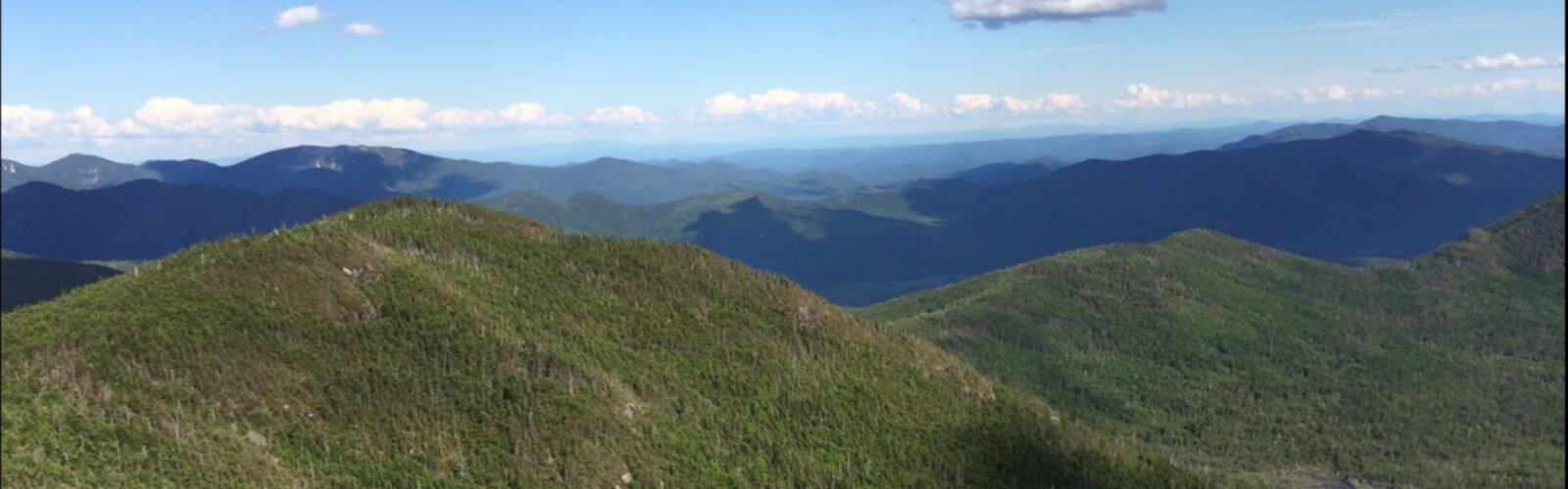 Hiking Mount Redfield, New York - panoramic view  mountain outdoor sky grass nature cloud hill hillside green landscape fell hiking overlooking grassy land lush distance highland